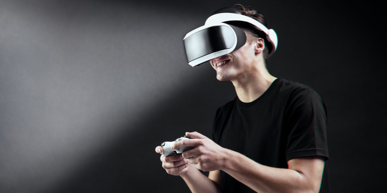 https://www.couponcodesme.com/blog/wp-content/uploads/man-playing-game-with-vr-headset-virtual-reality-experience-1280x640.jpg